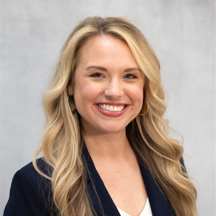 Headshot of Julia Baechle with EmpowerMe Wellness, smiling at the camera